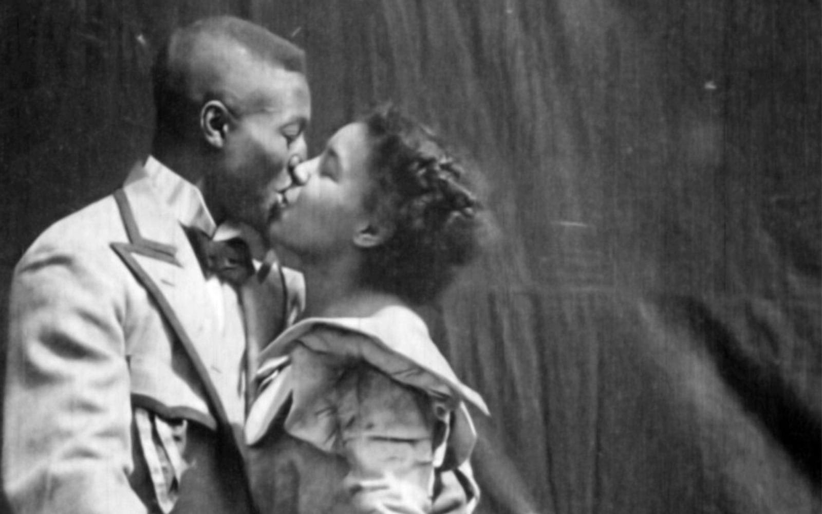 Black-and-white still of a couple kissing from the film Something Good – Negro Kiss.